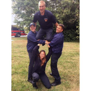 4 White River Twp firefighters posing in pyramid fashion